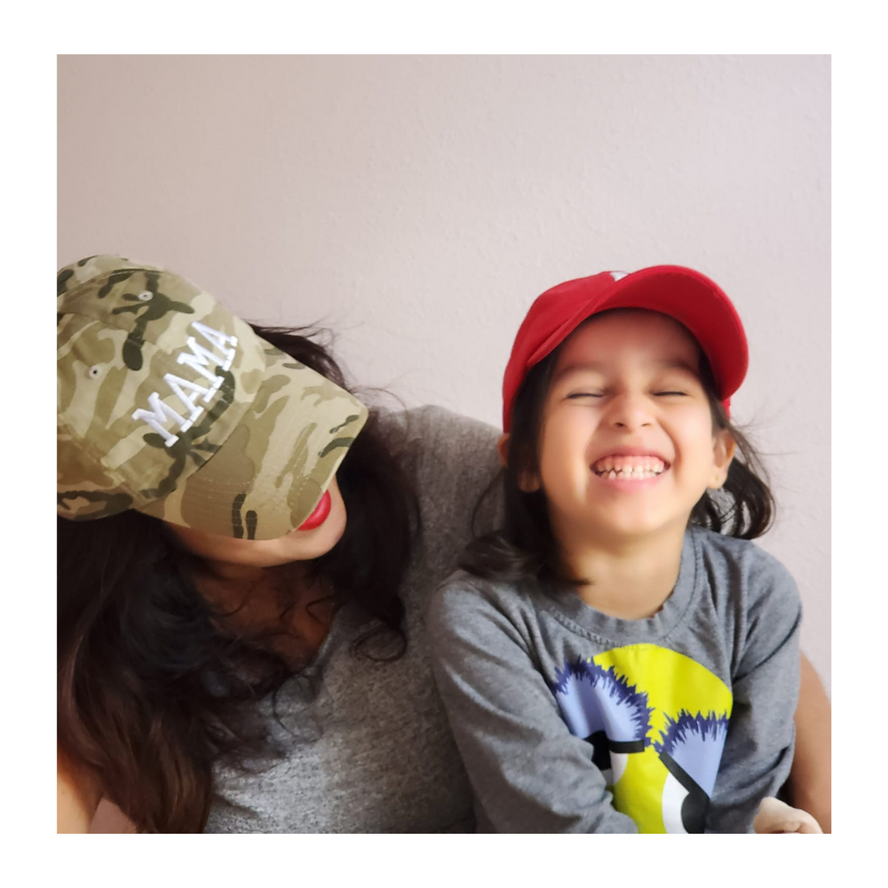Family portrait with a child wearing a red cap